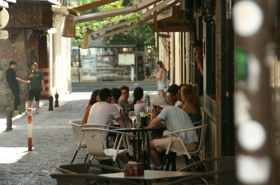 Friends sharing coffee and conversation at a neighbourhood café