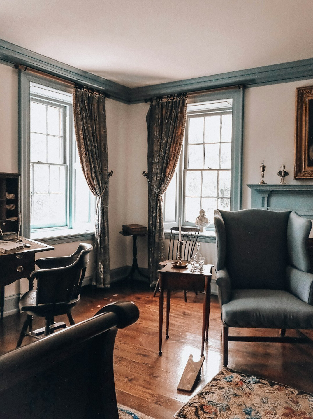 Writer reviewing notes at a desk near a window